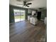 Open kitchen featuring modern appliances, an island, and smooth flooring at 427 W Whitley St, Norwood, NC 28128
