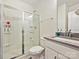 Clean and functional bathroom with glass-enclosed shower, white vanity, and modern fixtures at 4606 Gatesmills Ave, Charlotte, NC 28213