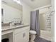 Bathroom featuring a shower and tub, with stylish vanity, and modern fixtures at 4606 Gatesmills Ave, Charlotte, NC 28213