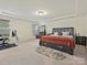Spacious bedroom with tray ceiling, carpet and natural light, creating a cozy atmosphere at 4606 Gatesmills Ave, Charlotte, NC 28213