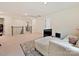 Bonus room with carpeting, white sofa, and natural lighting at 4606 Gatesmills Ave, Charlotte, NC 28213