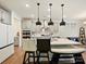 Well-appointed kitchen with stainless steel appliances, quartz countertops, and an island with bar seating at 4606 Gatesmills Ave, Charlotte, NC 28213