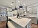 Modern kitchen with stainless steel appliances, quartz countertops, and pendant lighting over the island at 4606 Gatesmills Ave, Charlotte, NC 28213