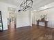 Spacious living room with hardwood floors and coffered ceiling, connecting seamlessly to the entryway at 4606 Gatesmills Ave, Charlotte, NC 28213