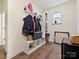 Functional mudroom with built-in storage and stylish wood-look flooring at 4606 Gatesmills Ave, Charlotte, NC 28213