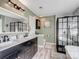 This bathroom features a double sink vanity and tub-shower with a black grid door at 4665 Madeline Dr, Rock Hill, SC 29732