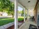 Inviting covered porch with white columns, brick accents, and a relaxing seating area at 4665 Madeline Dr, Rock Hill, SC 29732