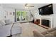 Bright living room with a fireplace, large windows, and comfortable seating at 4665 Madeline Dr, Rock Hill, SC 29732