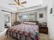 Serene bedroom with a decorative tray ceiling, en-suite bathroom, and a sliding barn door at 4665 Madeline Dr, Rock Hill, SC 29732
