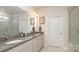 Beautiful bathroom featuring double sinks, granite countertops, and a tiled shower at 5043 Antebellum Dr, Iron Station, NC 28080