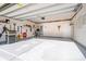 Spacious garage features epoxy flooring, tools, and custom license plate decorations at 5043 Antebellum Dr, Iron Station, NC 28080