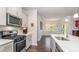 Well-appointed kitchen with stainless appliances and an island that opens to the eating area at 5043 Antebellum Dr, Iron Station, NC 28080