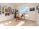 Bright office features a large window and displays a collection of Gathering photographs and decorations at 5043 Antebellum Dr, Iron Station, NC 28080