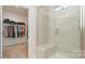 Shower featuring modern fixtures and a glass door. A walk-in closet is connected to the bathroom at 5043 Antebellum Dr, Iron Station, NC 28080