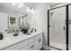 Modern bathroom with double vanity, a large mirror and a glass-enclosed shower at 528 Waco Rd, Kings Mountain, NC 28086