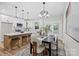 Well-lit dining area with a modern chandelier and views of the backyard at 528 Waco Rd, Kings Mountain, NC 28086