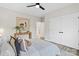 This bedroom features a ceiling fan, bedside table, area rug and white double-door closets at 528 Waco Rd, Kings Mountain, NC 28086