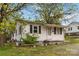 Cozy one-story home with front yard and mature trees at 545 S Green St, Statesville, NC 28677