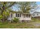 Cozy one-story home with front yard and mature trees at 545 S Green St, Statesville, NC 28677