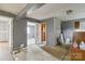 Unfinished living room featuring gray walls, bare floors, and open doorways for customization at 545 S Green St, Statesville, NC 28677
