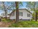 Exterior side view of a single-story home with light siding and black shutters at 545 S Green St, Statesville, NC 28677