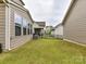 A backyard enclosed by a black fence, offering privacy and security at 6433 Raffia Rd, Charlotte, NC 28277