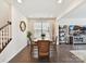 Spacious dining area featuring a rustic table, seamlessly blending with the open-concept living space at 6433 Raffia Rd, Charlotte, NC 28277