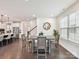 Dining area with view into the kitchen and seamlessly blending with the open-concept living space at 6433 Raffia Rd, Charlotte, NC 28277