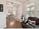 Welcoming entryway featuring hardwood floors, leading to the dining area and front door at 6433 Raffia Rd, Charlotte, NC 28277