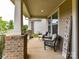 Relaxing front porch with comfortable seating and stylish decor at 6433 Raffia Rd, Charlotte, NC 28277
