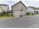 A two-car garage offers ample parking with a basketball hoop, enhancing the outdoor space at 6433 Raffia Rd, Charlotte, NC 28277