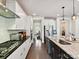 Well-equipped kitchen with stainless steel appliances, granite countertops, and ample cabinet space at 6433 Raffia Rd, Charlotte, NC 28277