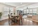 Open-concept living and dining area with lots of natural light, seamlessly connected for easy entertaining at 6433 Raffia Rd, Charlotte, NC 28277