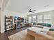 Inviting living room featuring a plush sectional sofa, a large TV, and plenty of natural light at 6433 Raffia Rd, Charlotte, NC 28277