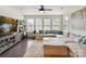 Cozy living room showcasing a sectional sofa, media center, and a neutral color palette at 6433 Raffia Rd, Charlotte, NC 28277