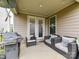 A covered patio with outdoor furniture, grill and plenty of space for entertaining at 6433 Raffia Rd, Charlotte, NC 28277