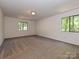 Carpeted bedroom featuring two windows with natural light at 6745 Thermal Rd, Charlotte, NC 28211