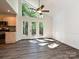 Dining room with wood floors and vaulted ceiling has access to a deck at 6745 Thermal Rd, Charlotte, NC 28211