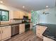 Spacious kitchen with stainless steel appliances, granite countertops, and a breakfast bar area at 6745 Thermal Rd, Charlotte, NC 28211