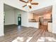 Open concept living room view to the modern kitchen with stainless steel appliances at 6745 Thermal Rd, Charlotte, NC 28211