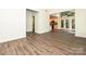 A spacious living room with wood floors is open to the kitchen and leads to a deck at 6745 Thermal Rd, Charlotte, NC 28211