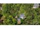 Aerial view of the property surrounded by mature trees, showcasing its privacy and landscaped grounds at 705 Normandy Rd, Mooresville, NC 28117
