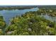 Stunning aerial view of the property nestled among trees, with a beautiful lake in the distance at 705 Normandy Rd, Mooresville, NC 28117