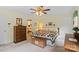Cozy bedroom featuring a ceiling fan, dresser and ample natural light at 705 Normandy Rd, Mooresville, NC 28117