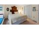 This bedroom has a large bed with decorative wood headboard and a closet for ample storage space at 705 Normandy Rd, Mooresville, NC 28117