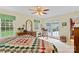 Comfortable bedroom with large windows, ceiling fan, and neutral decor, plenty of natural light at 705 Normandy Rd, Mooresville, NC 28117