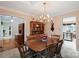 Traditional dining room with wooden table and chairs, chandelier lighting, and classic decor at 705 Normandy Rd, Mooresville, NC 28117