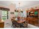 Inviting dining room with large windows, chandelier, and built-in hutch for elegant storage at 705 Normandy Rd, Mooresville, NC 28117