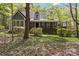 Charming home surrounded by lush greenery, featuring a welcoming front porch at 705 Normandy Rd, Mooresville, NC 28117
