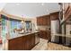 Well-lit kitchen with granite counters, stainless steel appliances and access to a dining area at 705 Normandy Rd, Mooresville, NC 28117